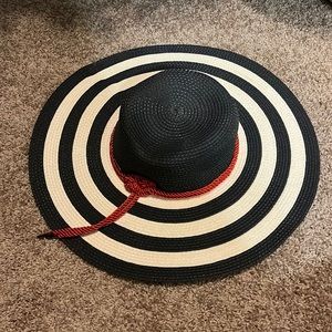 Navy and white floppy hat with tags